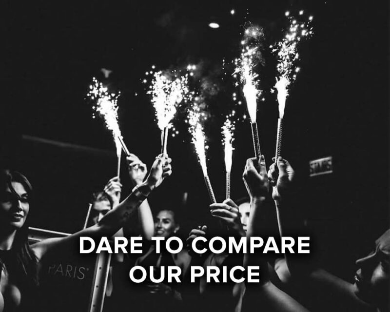 dare to compare our price, group raising sparklers in celebration
